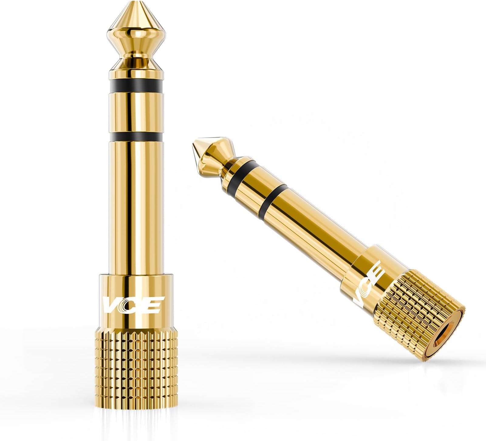 Two gold VCE stereo headphone adapters with quarter-inch plugs and 3.5 mm sockets.